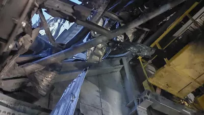 In this photo provided by the Ukrainian Emergency Service, damaged sarcophagus that covers the destroyed 4th reactor of Chernobyl nuclear power plant is seen from inside following a Russian drone attack in Chernobyl, Ukraine, Friday, Feb. 14, 2025. (Ukrainian Emergency Service via AP)