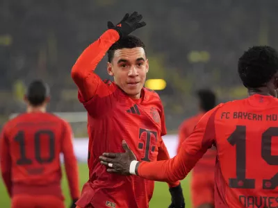 FILE - Bayern's Jamal Musiala celebrates after scoring during their German Bundesliga soccer match against Borussia Dortmund at the Signal-Iduna Park in Dortmund, Germany, Saturday, Nov. 30, 2024. (AP Photo/Martin Meissner, file)