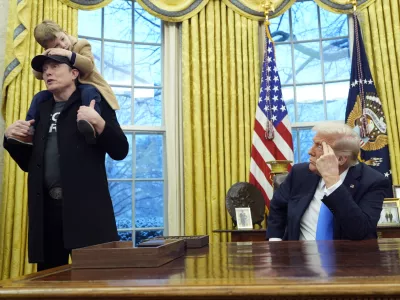 President Donald Trump listens as Elon Musk, joined by his son X Æ A-Xii, speaks in the Oval Office at the White House, Tuesday, Feb. 11, 2025, in Washington. (Photo/Alex Brandon)