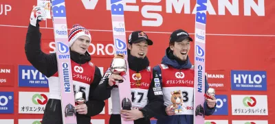 Japan's Royu Kobayashi, center, second placed Marius Lindvik of Norway, and third placed Johann Forfang of Norway pose together on the podium during the men's Ski Jumping World Cup event in Sapporo, northern Japan Sunday, Feb. 16, 2025. (Kyodo News via AP)