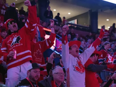 Fans cheer as Canada warms up prior to the first period 4 Nations Face-Off hockey game against the United States in Montreal on Saturday, Feb. 15, 2025. (Christinne Muschi/The Canadian Press via AP)