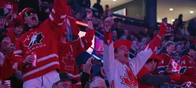 Fans cheer as Canada warms up prior to the first period 4 Nations Face-Off hockey game against the United States in Montreal on Saturday, Feb. 15, 2025. (Christinne Muschi/The Canadian Press via AP)