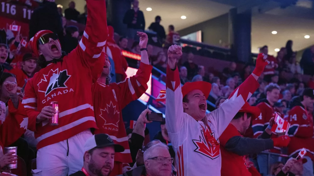 Fans cheer as Canada warms up prior to the first period 4 Nations Face-Off hockey game against the United States in Montreal on Saturday, Feb. 15, 2025. (Christinne Muschi/The Canadian Press via AP)