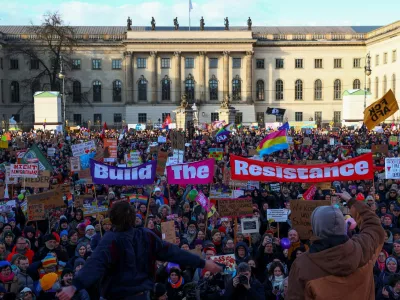 Demonstrators hold placards during a protest against right-wing extremism, racism, anti-Semitism and queerphobia and for social justice, fair working conditions, climate protection and responsible international politics ahead of the upcoming general election, in Berlin, Germany February 16, 2025. REUTERS/Christian Mang