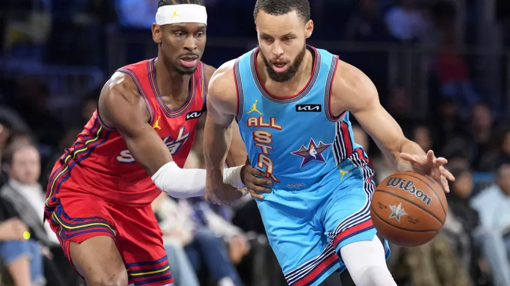 Feb 16, 2025; San Francisco, CA, USA; Shaq's OGs guard Stephen Curry (30) of the Golden State Warriors controls the ball against Chuck's Global Stars guard Shai Gilgeous-Alexander (2) of the Oklahoma City Thunder during the 2025 NBA All Star Game at Chase Center. Mandatory Credit: Kyle Terada-Imagn Images