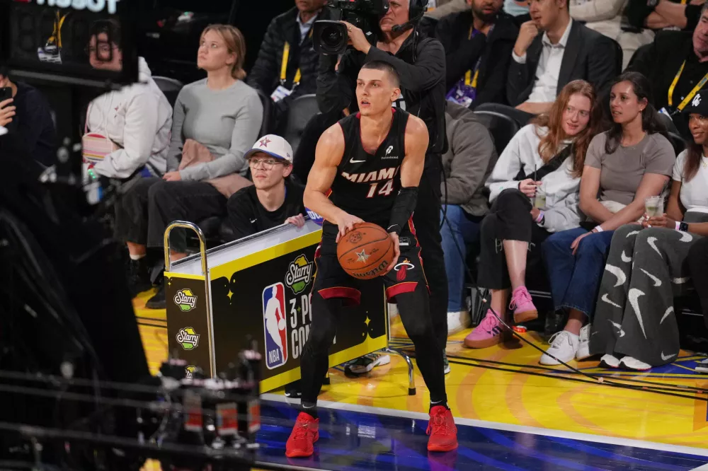 Feb 15, 2025; San Francisco, CA, USA; Miami Heat guard Tyler Herro (14) competes in the three-point contest during All Star Saturday Night ahead of the 2025 NBA All Star Game at Chase Center. Mandatory Credit: Cary Edmondson-Imagn Images