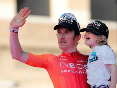 FILE PHOTO: Cycling - Giro d'Italia - Stage 21 - Roma to Roma - Italy - May 26, 2024 INEOS Grenadiers' Geraint Thomas celebrates his third place on the podium after the Giro d'Italia 2024 REUTERS/Ciro De Luca/File Photo