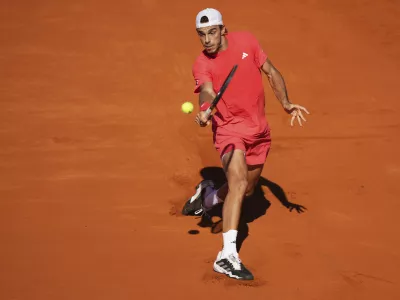 Argentina's Francisco Cerundolo returns the ball to Brazil's Joao Fonseca during a men's singles final match at the Argentina Open ATP tennis tournament at Guillermo Vilas Stadium in Buenos Aires, Argentina, Sunday, Feb. 16, 2025. (AP Photo/Gustavo Garello)