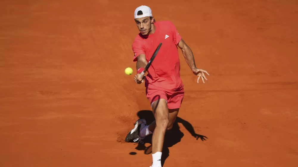 Argentina's Francisco Cerundolo returns the ball to Brazil's Joao Fonseca during a men's singles final match at the Argentina Open ATP tennis tournament at Guillermo Vilas Stadium in Buenos Aires, Argentina, Sunday, Feb. 16, 2025. (AP Photo/Gustavo Garello)