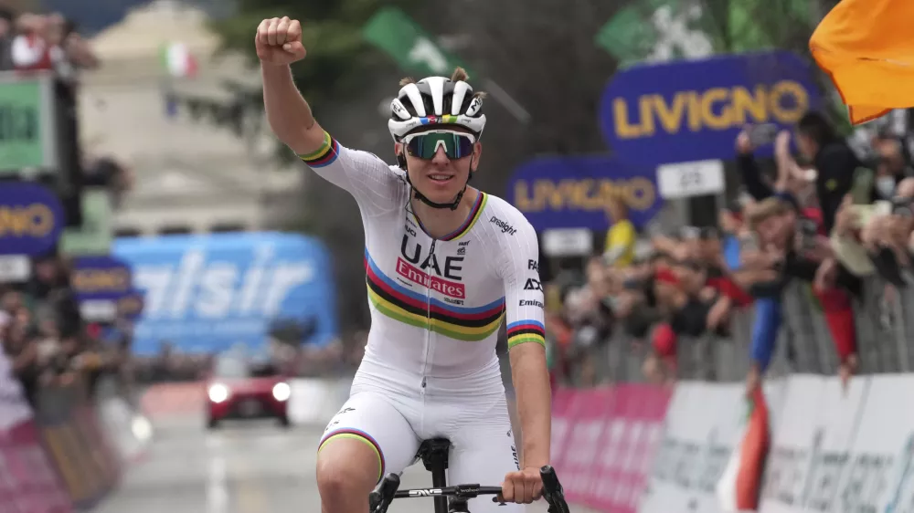 Reigning World Champion Slovenia's Tadej Pogacar celebrates winning Il Lombardia, Tour of Lombardy cycling race, in Como, Italy, Saturday, Oct. 12, 2024. (Gian Mattia D'Alberto/LaPresse via AP)