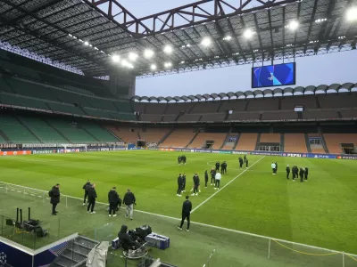 Feyenoord players stand on the pitch at the San Siro stadium in Milan, Italy, Monday, Feb.17, 2025, during a walk around ahead the tomorrow's Champions League, playoff second leg soccer match between AC Milan and Feyenoord. (AP Photo/Luca Bruno)