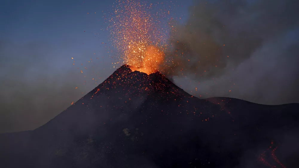 Lava rises from a crater of Mount Etna, Europe's most active volcano, Italy July 2, 2024. REUTERS/Etna Walk/Giuseppe Di Stefano