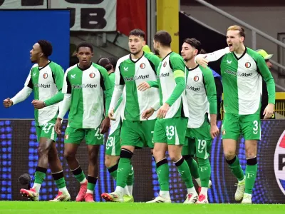 Soccer Football - Champions League - Knockout Phase Playoff - Second Leg - AC Milan v Feyenoord - San Siro, Milan, Italy - February 18, 2025 Feyenoord's Julian Carranza celebrates scoring their first goal with teammates REUTERS/Daniele Mascolo