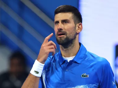 Tennis - Qatar Open - Khalifa International Tennis and Squash Complex, Doha, Qatar - February 18, 2025 Serbia's Novak Djokovic looks dejected after losing his round of 32 match against Italy's Matteo Berrettini REUTERS/Ibraheem Al Omari