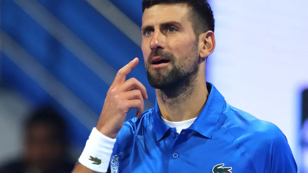 Tennis - Qatar Open - Khalifa International Tennis and Squash Complex, Doha, Qatar - February 18, 2025 Serbia's Novak Djokovic looks dejected after losing his round of 32 match against Italy's Matteo Berrettini REUTERS/Ibraheem Al Omari