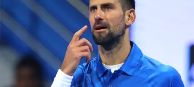 Tennis - Qatar Open - Khalifa International Tennis and Squash Complex, Doha, Qatar - February 18, 2025 Serbia's Novak Djokovic looks dejected after losing his round of 32 match against Italy's Matteo Berrettini REUTERS/Ibraheem Al Omari