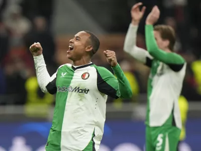 Feyenoord's Igor Paixao players celebrates with teammates after the Champions League, playoff second leg soccer match between AC Milan and Feyenoord, at the San Siro stadium in Milan, Italy, Tuesday, Feb.18, 2025. (AP Photo/Luca Bruno)