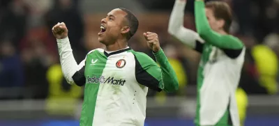 Feyenoord's Igor Paixao players celebrates with teammates after the Champions League, playoff second leg soccer match between AC Milan and Feyenoord, at the San Siro stadium in Milan, Italy, Tuesday, Feb.18, 2025. (AP Photo/Luca Bruno)