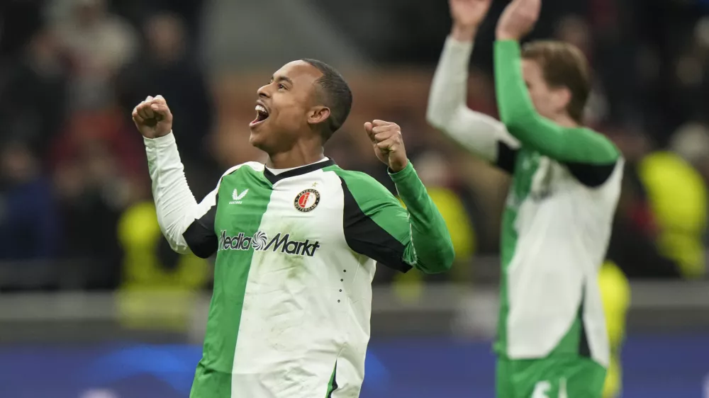 Feyenoord's Igor Paixao players celebrates with teammates after the Champions League, playoff second leg soccer match between AC Milan and Feyenoord, at the San Siro stadium in Milan, Italy, Tuesday, Feb.18, 2025. (AP Photo/Luca Bruno)