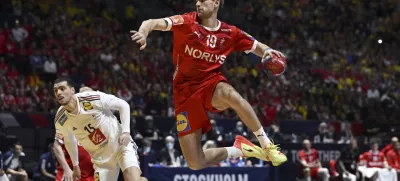 France's Mathieu Grebille and Denmark's Mathias Gidsel during the IHF Men's World Championship handball final match between France and Denmark at Tele2 Arena, Stockholm, Sweden, Sunday Jan. 29, 2023. (Jessica Gow/TT News Agency via AP)