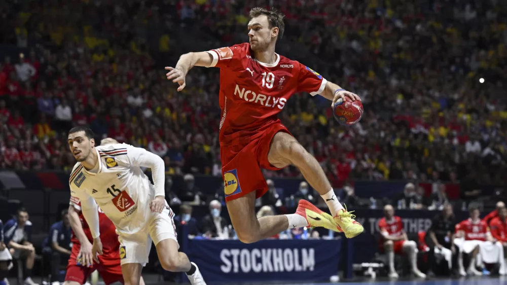 France's Mathieu Grebille and Denmark's Mathias Gidsel during the IHF Men's World Championship handball final match between France and Denmark at Tele2 Arena, Stockholm, Sweden, Sunday Jan. 29, 2023. (Jessica Gow/TT News Agency via AP)