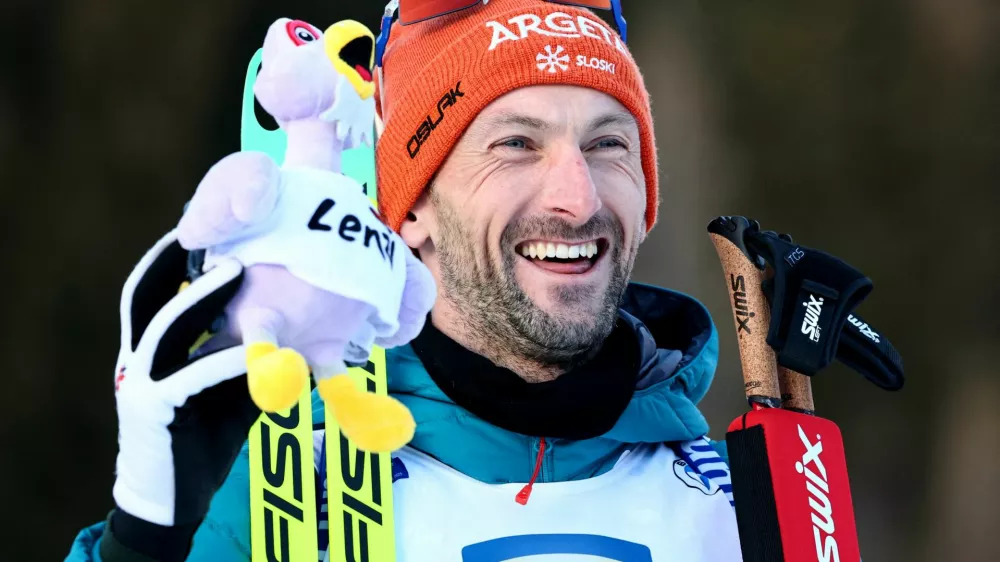 Winter Sports - Biathlon World Championships - Men's 20Km Individual - Lenzerheide, Switzerland - February 19, 2025 Slovenia's Jakov Fak celebrates sixth position in the Men's 20Km Individual REUTERS/Denis Balibouse