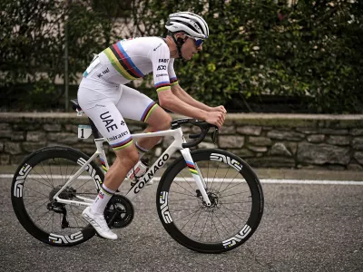 Reigning World Champion Slovenia's Tadej Pogacar pedals on his way to win Il Lombardia, Tour of Lombardy cycling race, in Como, Italy, Saturday, Oct. 12, 2024. (Marco Alpozzi/LaPresse via AP)