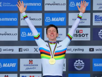 Cycling - UCI World Championships 2024 - Men's Elite Road Race - Zurich, Switzerland - September 29, 2024 Gold medallist Slovenia's Tadej Pogacar celebrates on the podium REUTERS/Denis Balibouse