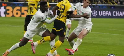 Sporting's Ousmane Diomande, left, and Eduardo Quaresma hold Dortmund's Jamie Bynoe-Gittens during the Champions League playoff second leg soccer match between Borussia Dortmund and Sporting CP at the Signa-Iduna Park in Dortmund, Germany, Wednesday, Feb. 19, 2025. (AP Photo/Martin Meissner)