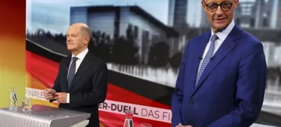 Olaf Scholz, German Chancellor of the Social Democratic Party (SPD), left, and Friedrich Merz, right, leader of the Christian Democratic Union (CDU), are pictured in tv studio ahead of a debate in Berlin, Germany, Wednesday, Feb. 19, 2025. (Fabrizio Bensch/Pool Photo via AP)