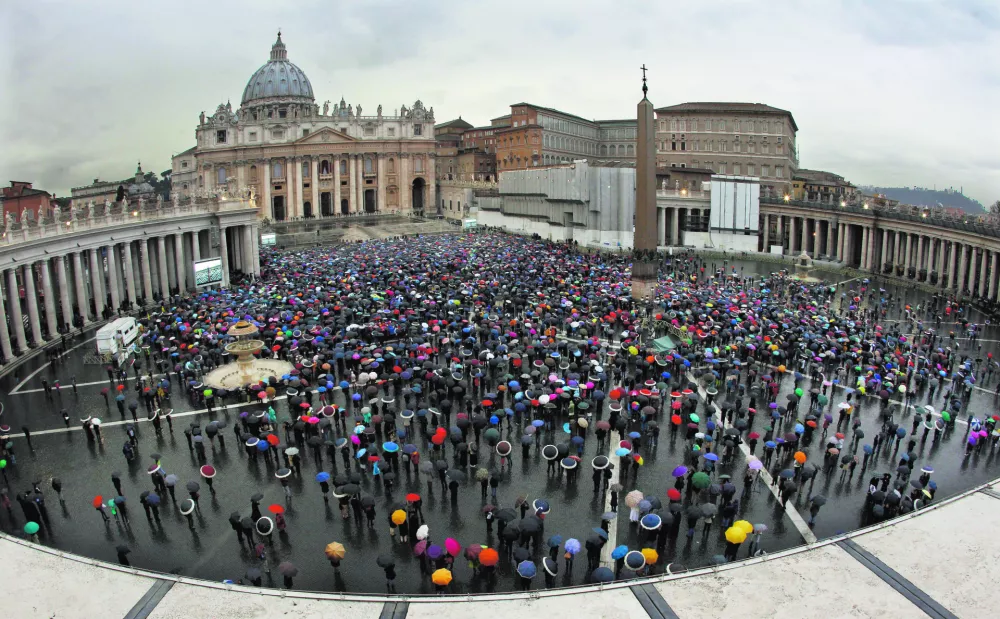 ﻿Crowds gather in St. Peter's Square to wait for the election of a new pope by the cardinals in conclave in the Sistine Chapel at the Vatican, Wednesday, March 13, 2013. (AP Photo/Andrew Medichini)