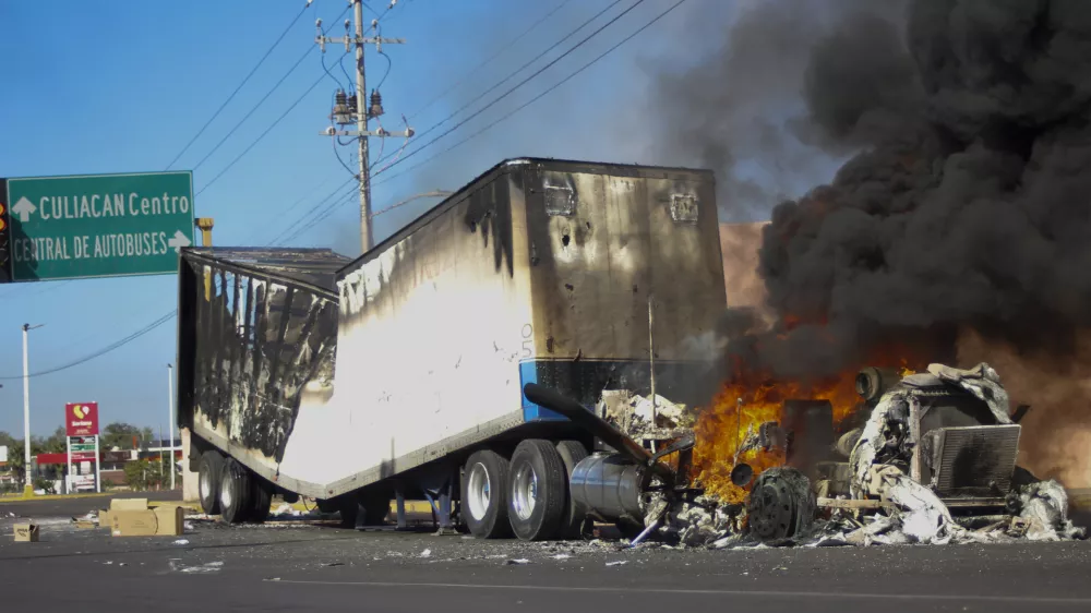 FILE - A truck burns on a street in Culiacan, Sinaloa state, Mexico, Jan. 5, 2023, after Mexican security forces captured Ovidio Guzmán, a son of former Sinaloa cartel boss Joaquín "El Chapo" Guzmán, which set off gunfights and roadblocks. (AP Photo/Martin Urista, File)