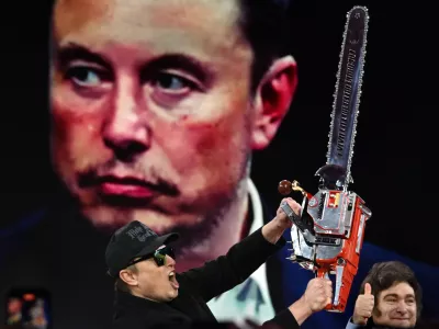 21 February 2025, US, Oxen Hill: Elon Musk is given a chainsaw as a gift by Argentine President Javier Millei during his appearance at CPAC, the annual Conservative Political Action Conference at the Gaylord Convention Center in Oxen Hill MD. Photo: Carol Guzy/ZUMA Press Wire/dpa