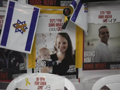 A poster shows Shiri Bibas, who was kidnapped to Gaza with her husband and two young sons on Oct. 7, 2023, in Jerusalem, Friday, Feb. 21, 2025. (AP Photo/Mahmoud Illean)