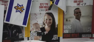 A poster shows Shiri Bibas, who was kidnapped to Gaza with her husband and two young sons on Oct. 7, 2023, in Jerusalem, Friday, Feb. 21, 2025. (AP Photo/Mahmoud Illean)