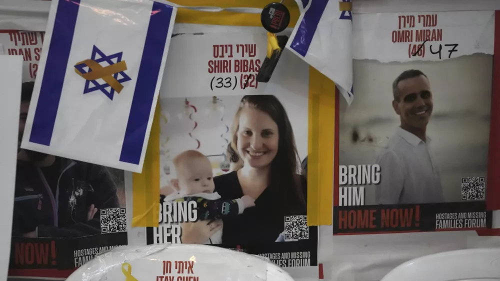 A poster shows Shiri Bibas, who was kidnapped to Gaza with her husband and two young sons on Oct. 7, 2023, in Jerusalem, Friday, Feb. 21, 2025. (AP Photo/Mahmoud Illean)