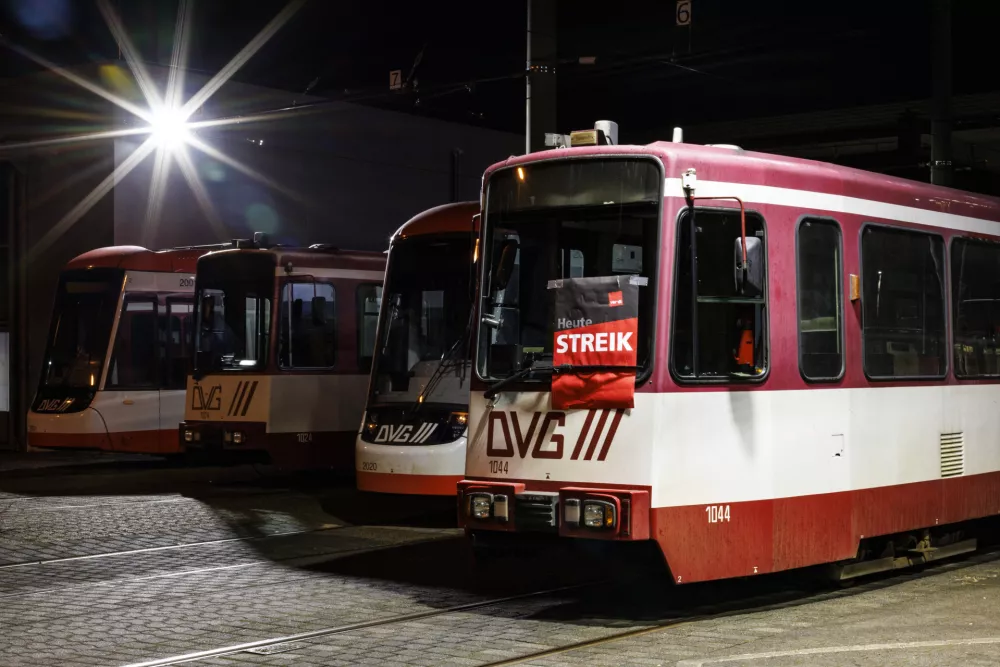 21 February 2025, North Rhine-Westphalia, Duisburg: A strike poster from the Verdi trade union hangs on one of the streetcars parking on the company premises in Duisburg. Photo: Christoph Reichwein/dpa