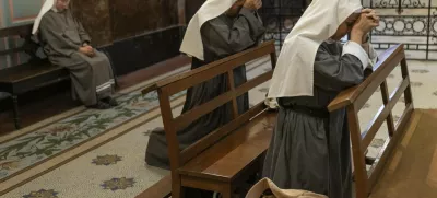 Missionary nuns pray for the health of Pope Francis at the Metropolitan Cathedral in Buenos Aires, Argentina, Friday, Feb. 21, 2025. (AP Photo/Rodrigo Abd)