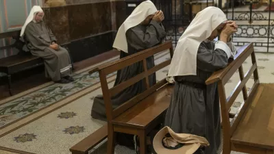 Missionary nuns pray for the health of Pope Francis at the Metropolitan Cathedral in Buenos Aires, Argentina, Friday, Feb. 21, 2025. (AP Photo/Rodrigo Abd)