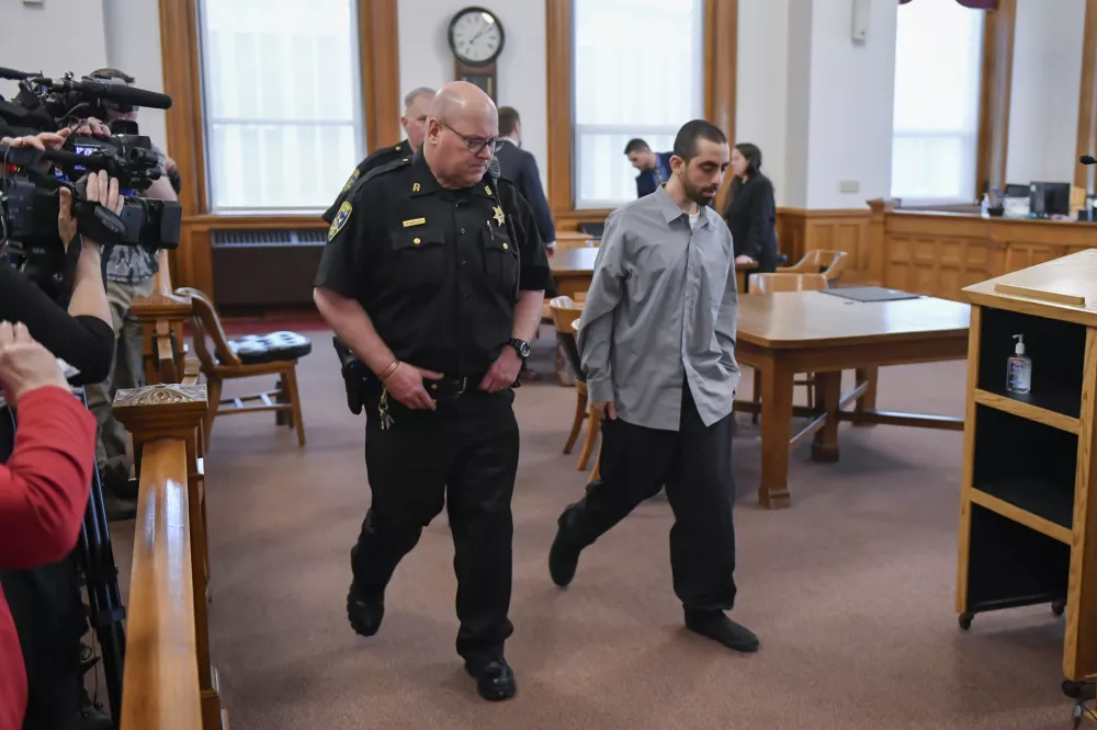 Hadi Matar, right, is led out of Chautauqua County court after the guilty verdict in the August 2022 knife attack of author Salman Rushdie in Mayville, N.Y., Friday, Feb. 21, 2025. (AP Photo/Adrian Kraus)