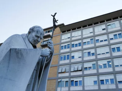 The statue of the late Pope John Paul II stands outside the Gemelli Hospital, where Pope Francis is admitted for treatment, in Rome, Italy, February 22, 2025. REUTERS/Ciro De Luca