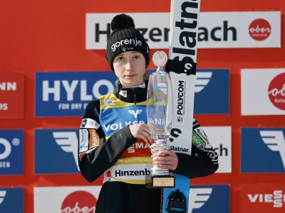 Ski Jumping - FIS Ski Jumping World Cup - Hinzenbach, Austria - February 22, 2025 Slovenia's Nika Prevc celebrates on the podium with a trophy after winning in the Women's Normal Hill Individual REUTERS/Lisa Leutner