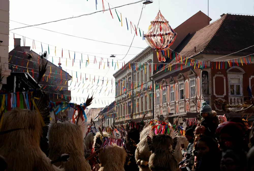 Participants dressed in costumes perform at the traditional festival Kurentovanje in Ptuj, Slovenia, February 22, 2025. REUTERS/Borut Zivulovic