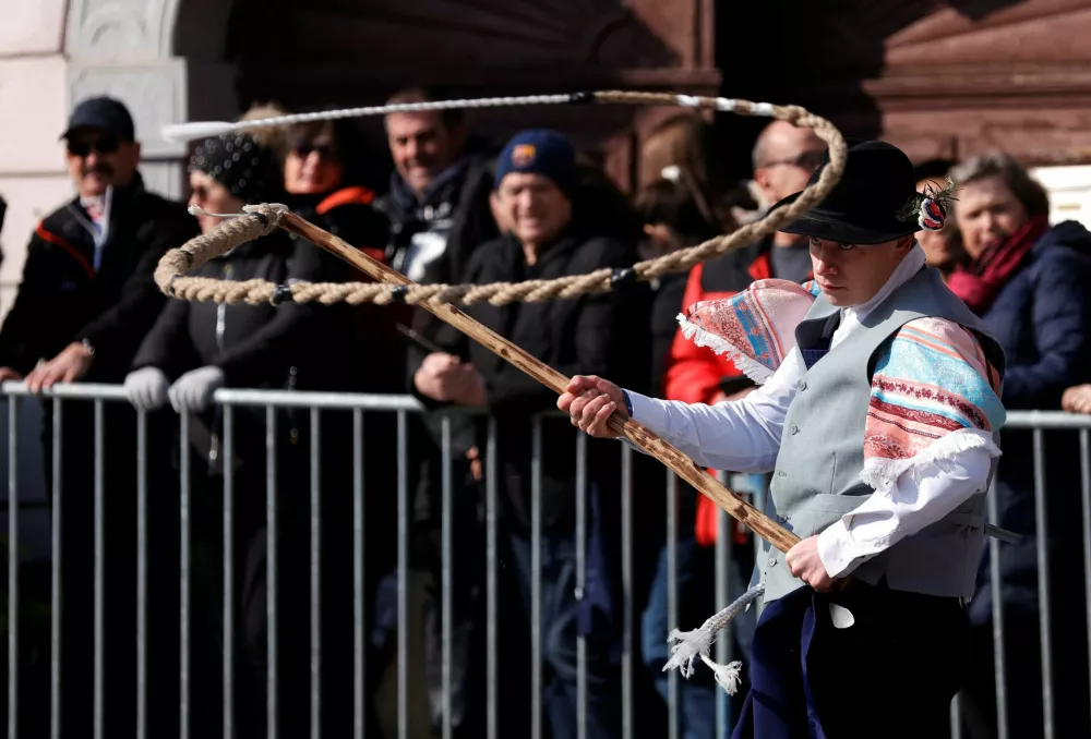 A participant dressed in a costume performs in the traditional festival Kurentovanje in Ptuj, Slovenia, February 22, 2025. REUTERS/Borut Zivulovic