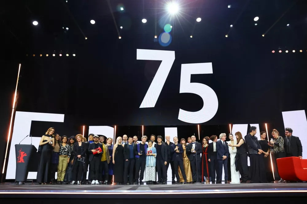 The winners of the Golden Bear and Silver Bear awards gather onstage accompanied by jury members, cast members, producers and others at the end of the awards ceremony at the 75th Berlinale International Film Festival in Berlin, Germany, February 22, 2025. REUTERS/Fabrizio Bensch