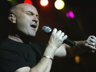 Phil Collins performs at the concert in occasion of the pre-screening of the new Disney movie "Brother Bear", for wich he wrote the soundtrack, Saturday, March 20, 2004 in the Arena in Geneva, Switzerland. (AP Photo/Keystone/Georgios Kefalas)