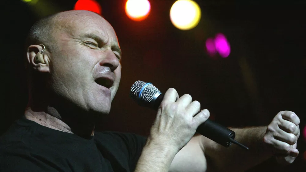 Phil Collins performs at the concert in occasion of the pre-screening of the new Disney movie "Brother Bear", for wich he wrote the soundtrack, Saturday, March 20, 2004 in the Arena in Geneva, Switzerland. (AP Photo/Keystone/Georgios Kefalas)