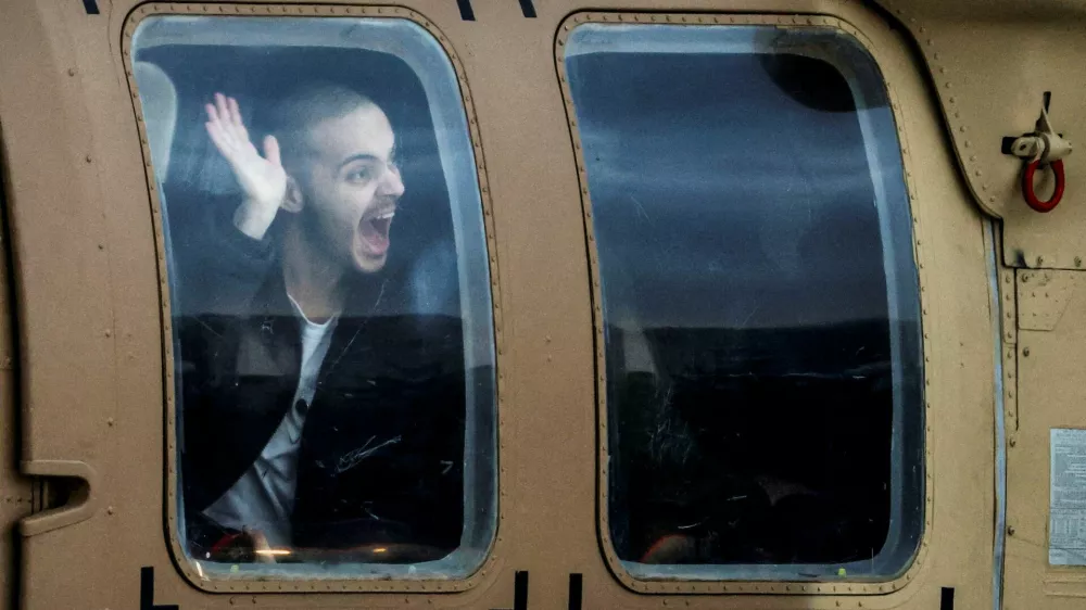 Omer Wenkert, a hostage who was held in Gaza since the deadly October 7, 2023 attack, sits inside a helicopter after he was released from captivity as part of a hostages-prisoners swap and a ceasefire deal between Hamas and Israel, at Beilinson Schneider complex in Petah Tikva, Israel, February 22, 2025. REUTERS/Nir Elias REFILE - QUALITY REPEAT