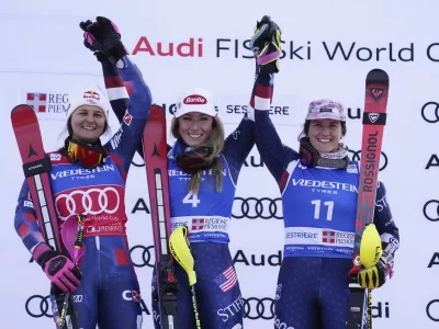 From left, second placed Croatia's Zrinka Ljutic, the winner United States' Mikaela Shiffrin and third placed United States' Paula Moltzan celebrate after an alpine ski, women's World Cup slalom, in Sestriere, Italy, Sunday, Feb. 23, 2025. (AP Photo/Piermarco Tacca)