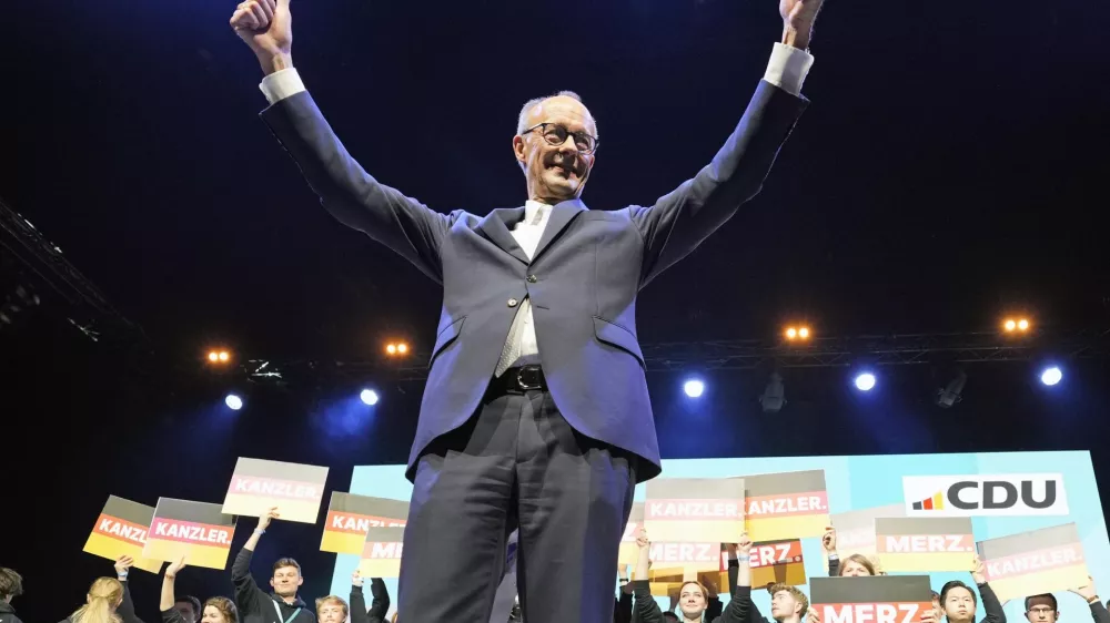 CDU top candidate for chancellor Friedrich Merz cheers to supporters at the main election campaign event of the Christian Democratic Union, Friday, Feb. 21, 2025, in Oberhausen, Germany, ahead of Sunday's German federal Bundestag elections. (AP Photo/Martin Meissner)